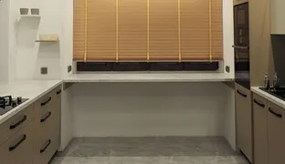 Kitchen - Caffe latte on a marble saucer with a black spoon